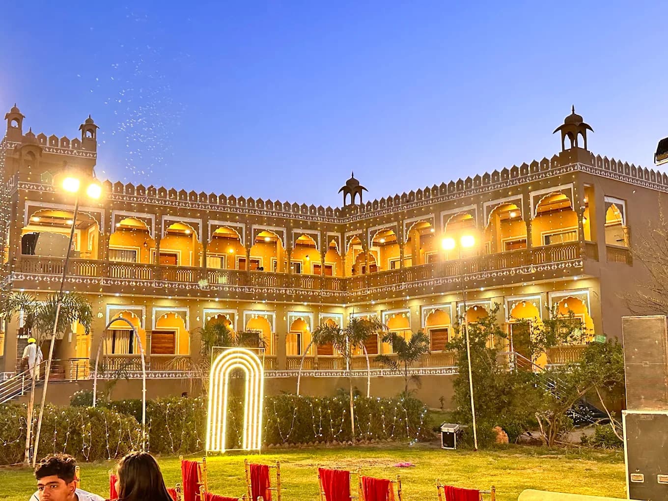 The palace façade at dusk