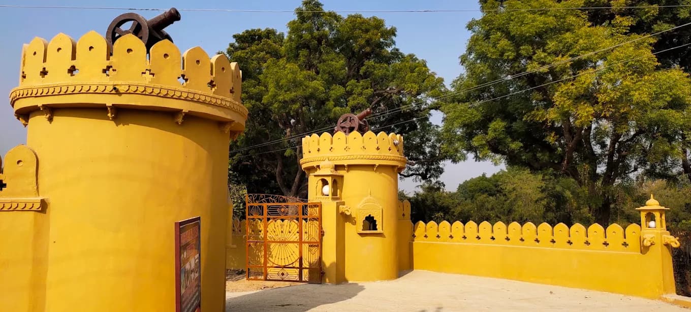 Yellow fort gate with turrets and a cannon